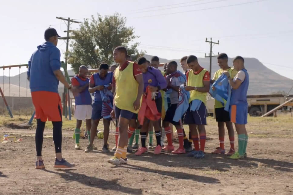 A group of young men with their soccer coach